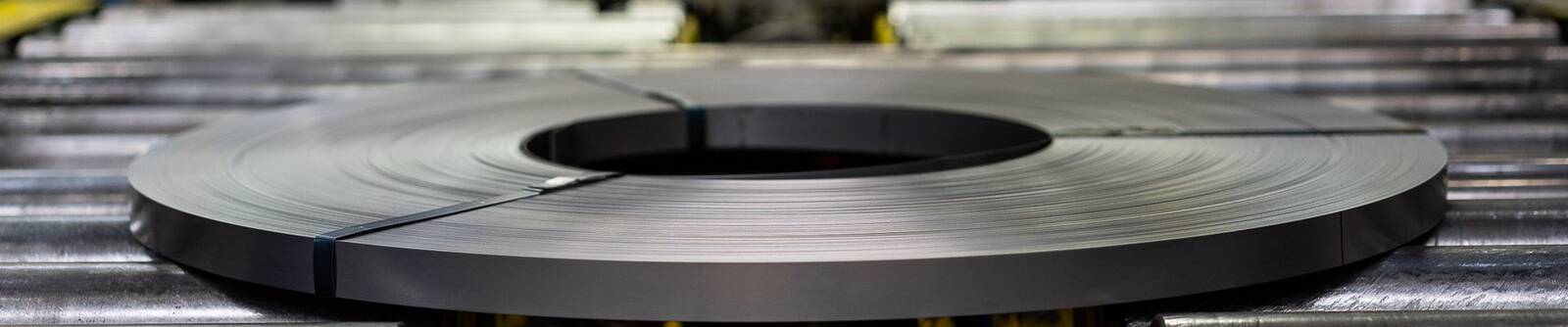 Flat rolled wire coil on a rolling conveyor at the plant in Italy